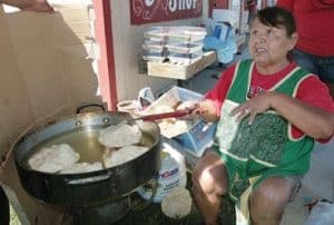 Indian woman makes fry bread